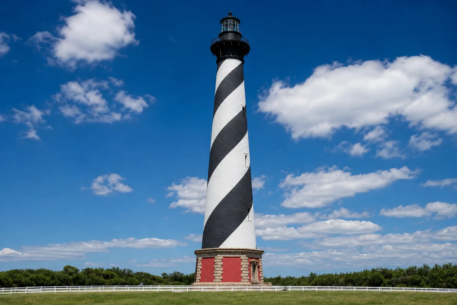 Cape Hatteras Lighthouse rising above dunes and sea grass on Hatteras Island