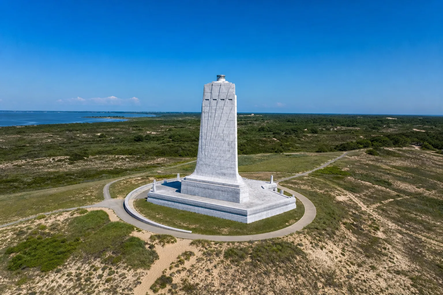 Aerial view of Kill Devil Hills beach road with the Wright Brothers Memorial monument in the distance